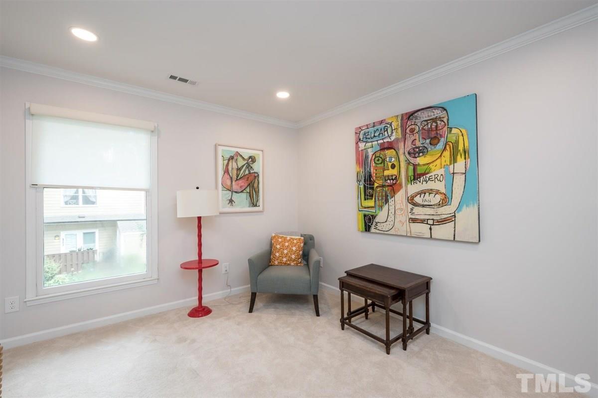 3245 Mill Run, Unit 3245 Raleigh, NC 27612 - Photo 19 of 24 a living room with furniture and a window