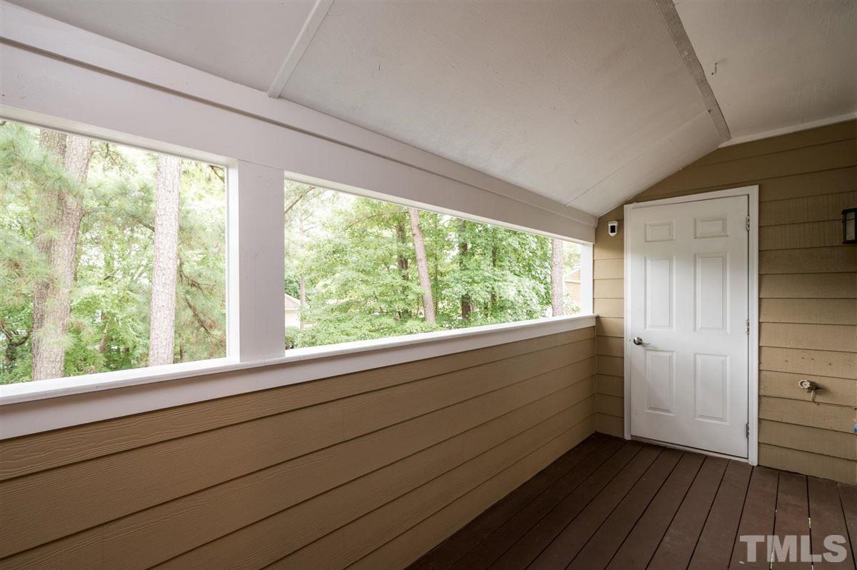 3245 Mill Run, Unit 3245 Raleigh, NC 27612 - Photo 21 of 24 a view of an empty room with wooden floor and a window