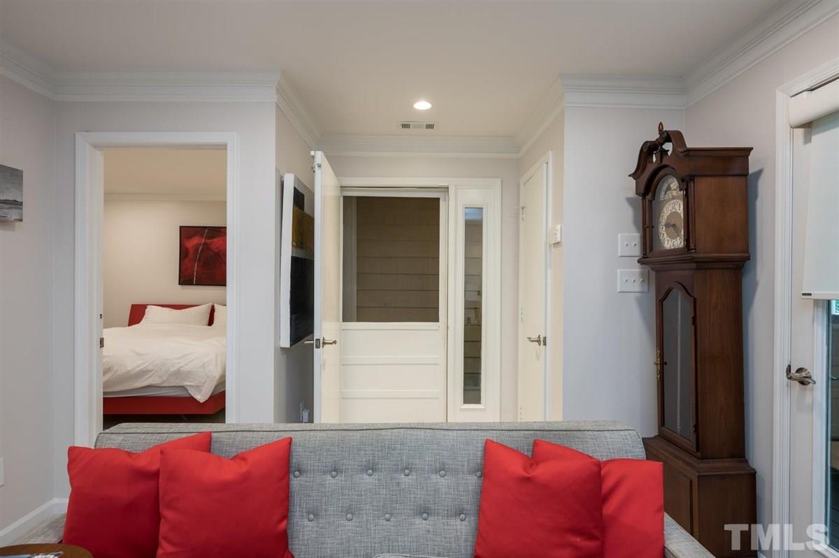 3245 Mill Run, Unit 3245 Raleigh, NC 27612 - Photo 4 of 24 a bedroom with furniture and a bed