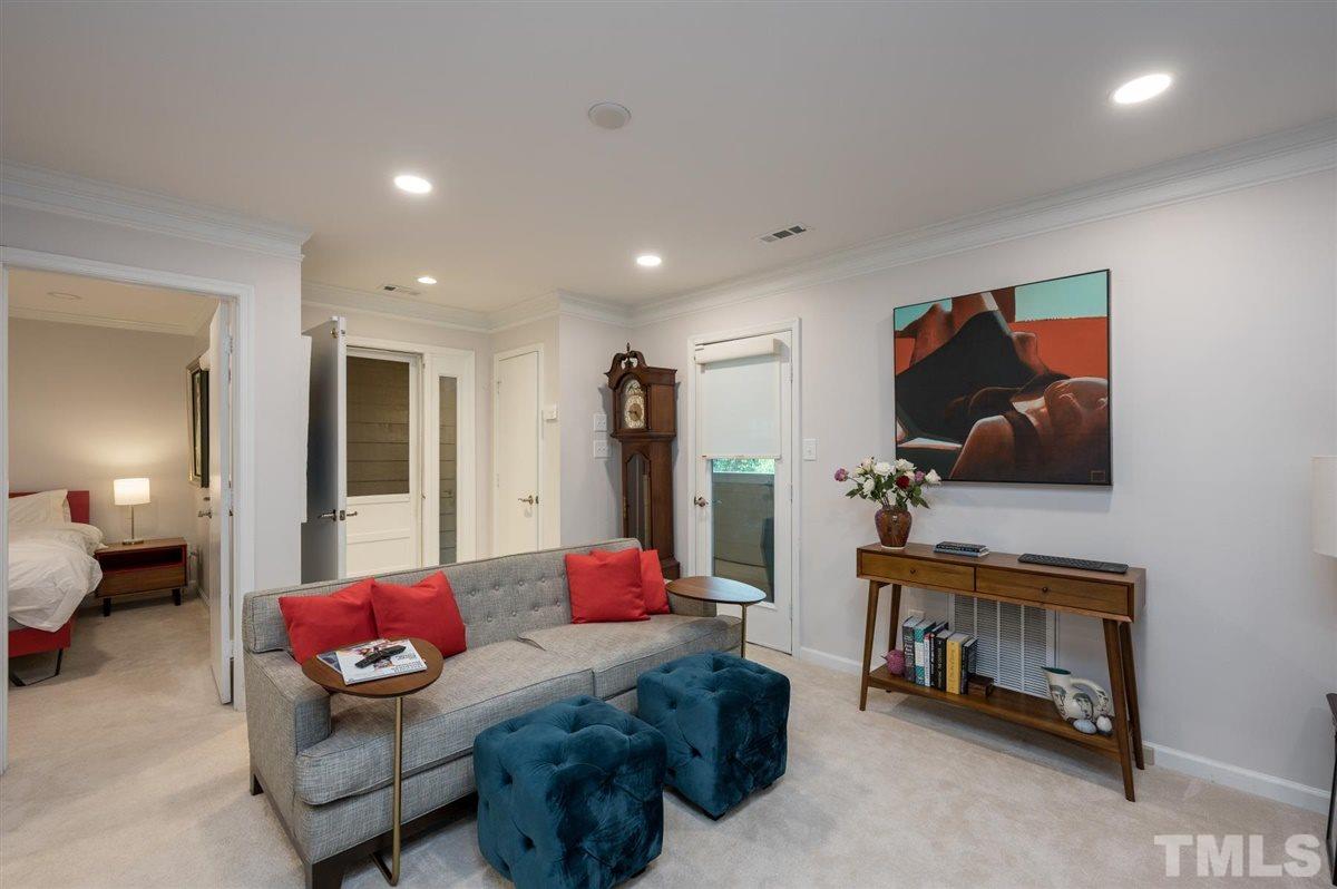 3245 Mill Run, Unit 3245 Raleigh, NC 27612 - Photo 6 of 24 a living room with furniture and a flat screen tv