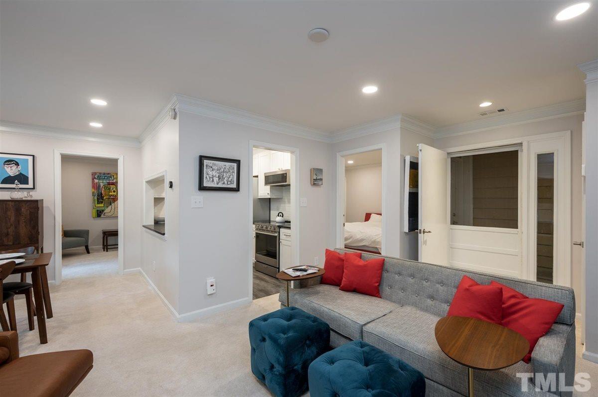 3245 Mill Run, Unit 3245 Raleigh, NC 27612 - Photo 7 of 24 a living room with furniture and a wooden floor
