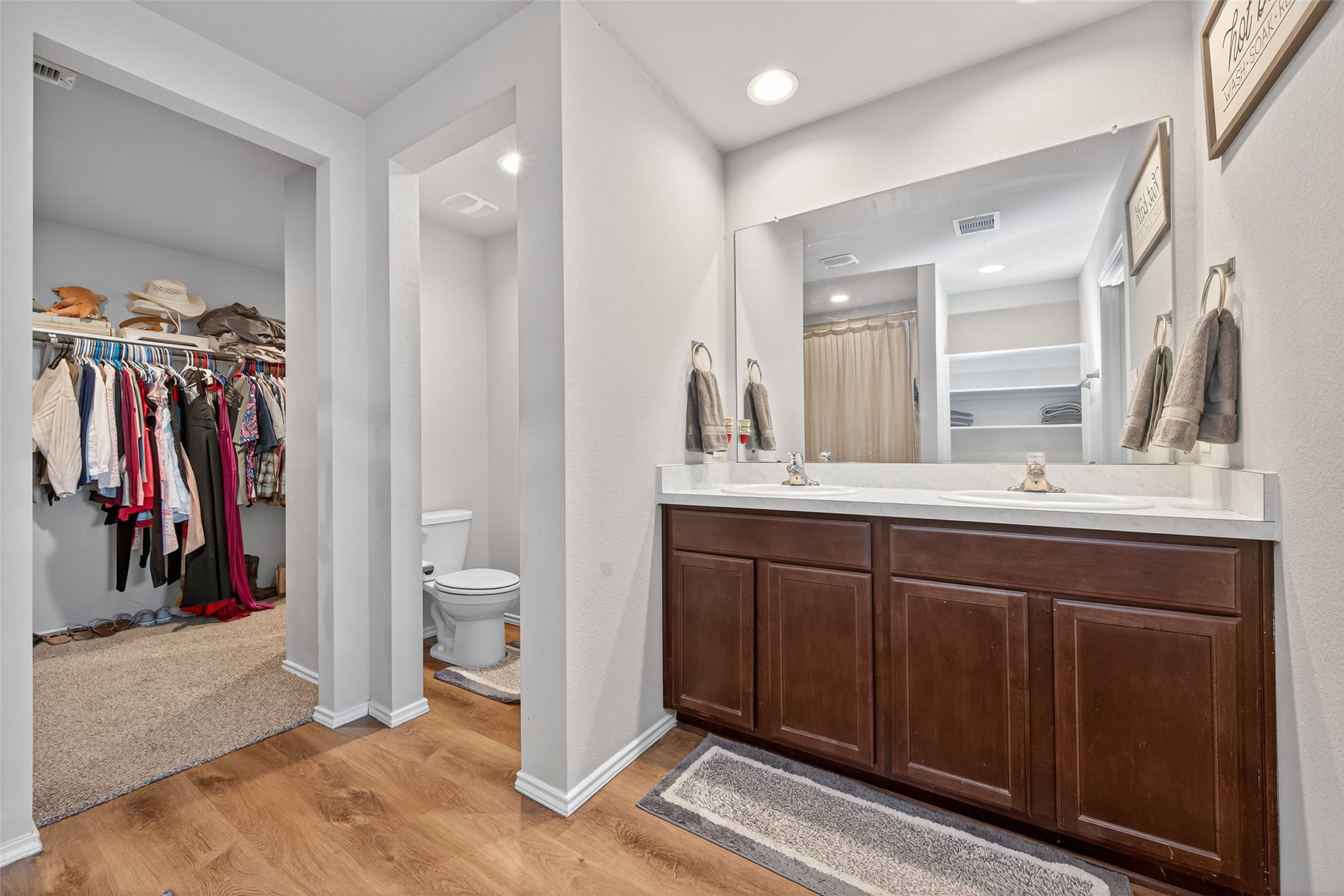 23706 Blodgett Peak Trail Spring, TX 77373 - Photo 17 of 31 a bathroom with a double vanity sink and a mirror