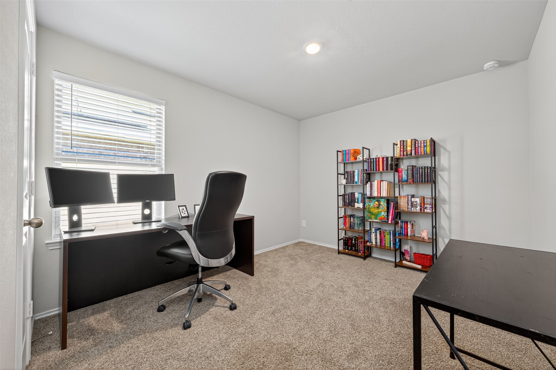23706 Blodgett Peak Trail Spring, TX 77373 - Photo 20 of 31 a view of a workspace with furniture and a window