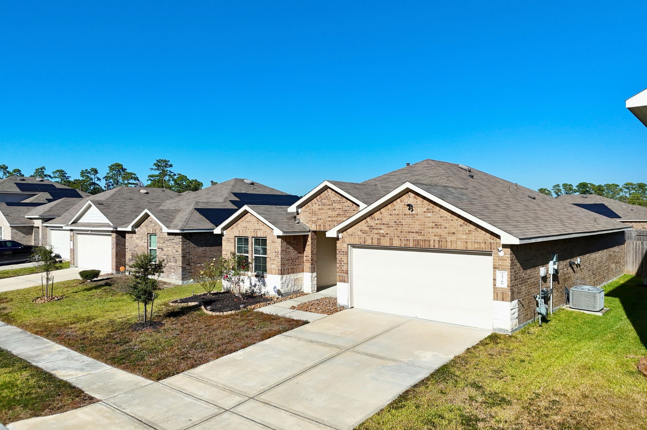 23706 Blodgett Peak Trail Spring, TX 77373 - Photo 28 of 31 a front view of a house with a yard and garage