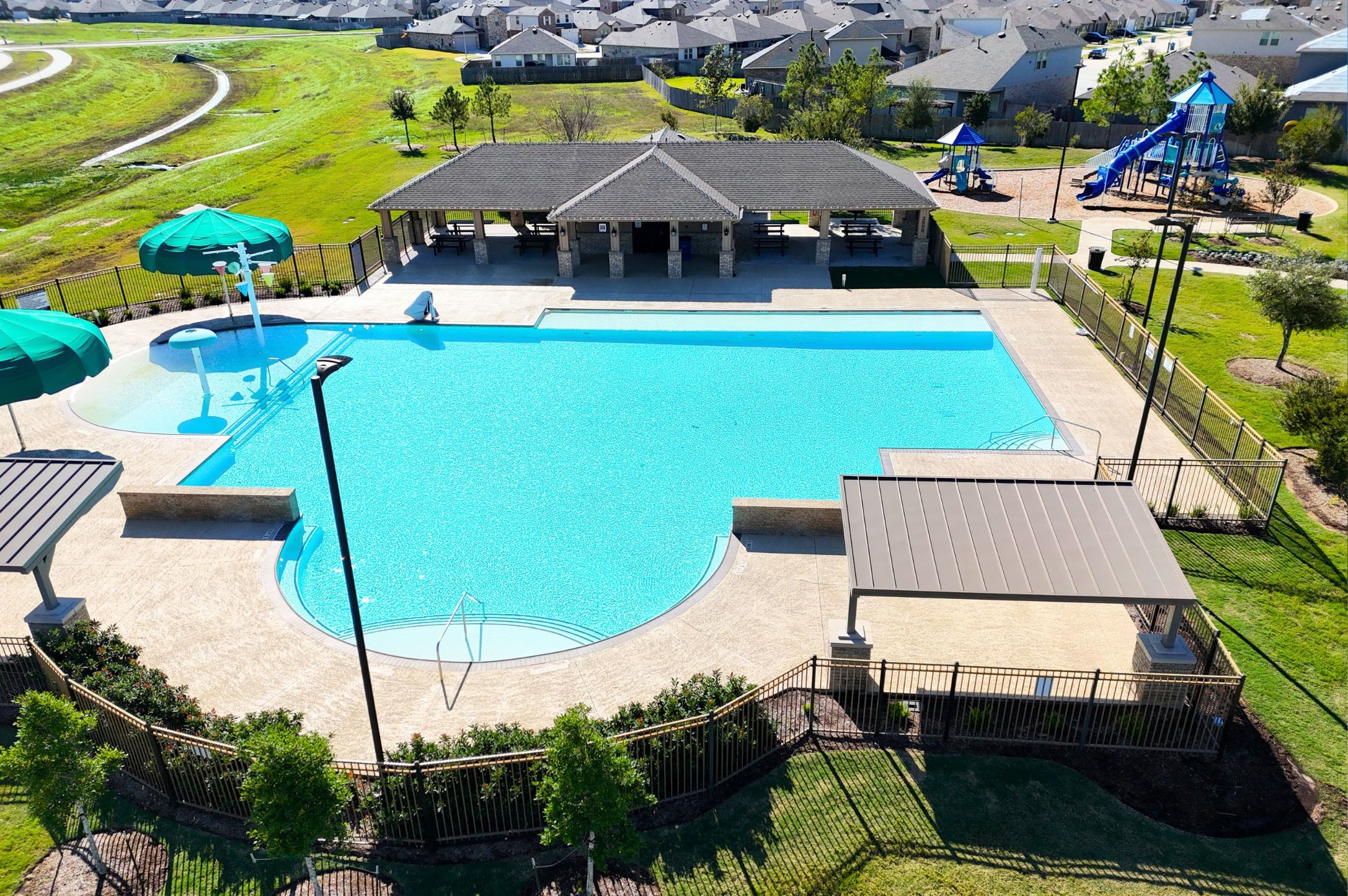23706 Blodgett Peak Trail Spring, TX 77373 - Photo 3 of 31 an aerial view of a house with swimming pool lawn chairs and large trees