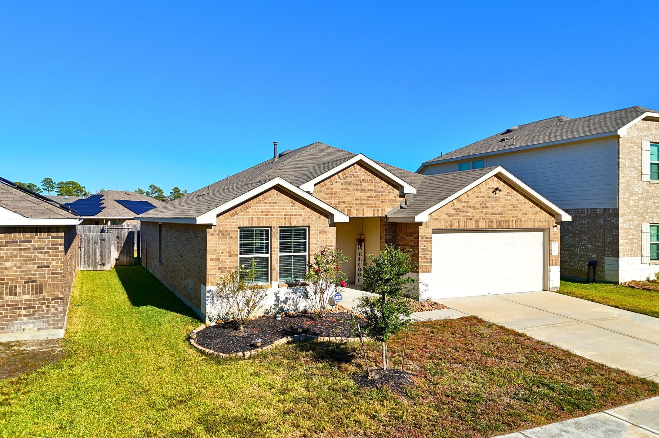 23706 Blodgett Peak Trail Spring, TX 77373 - Photo 30 of 31 a front view of a house with a yard and garage