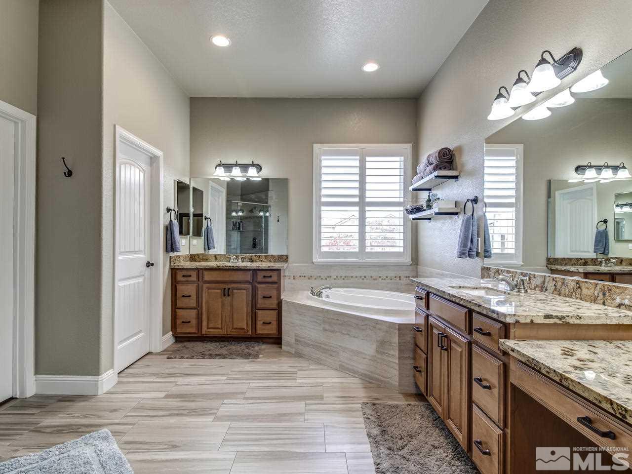 505 Split Rail Court Sparks, NV 89441 - Photo 13 of 25 a large kitchen with a large counter top a sink stainless steel appliances and cabinets