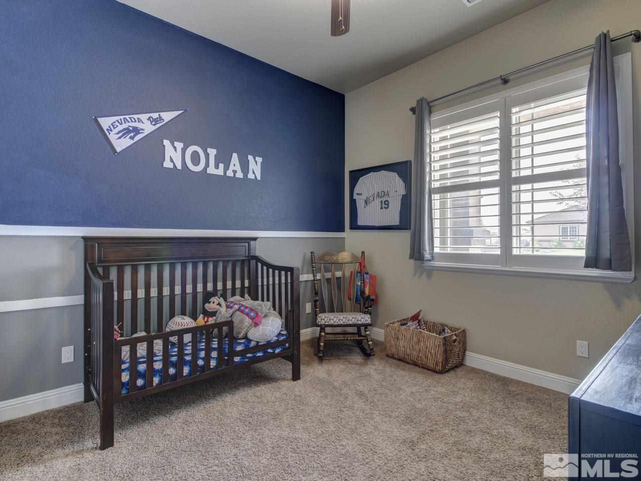 505 Split Rail Court Sparks, NV 89441 - Photo 19 of 25 a bedroom with furniture and a window