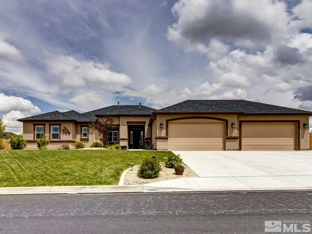 505 Split Rail Court Sparks, NV 89441 - Photo 2 of 25 a front view of a house with a yard and garage