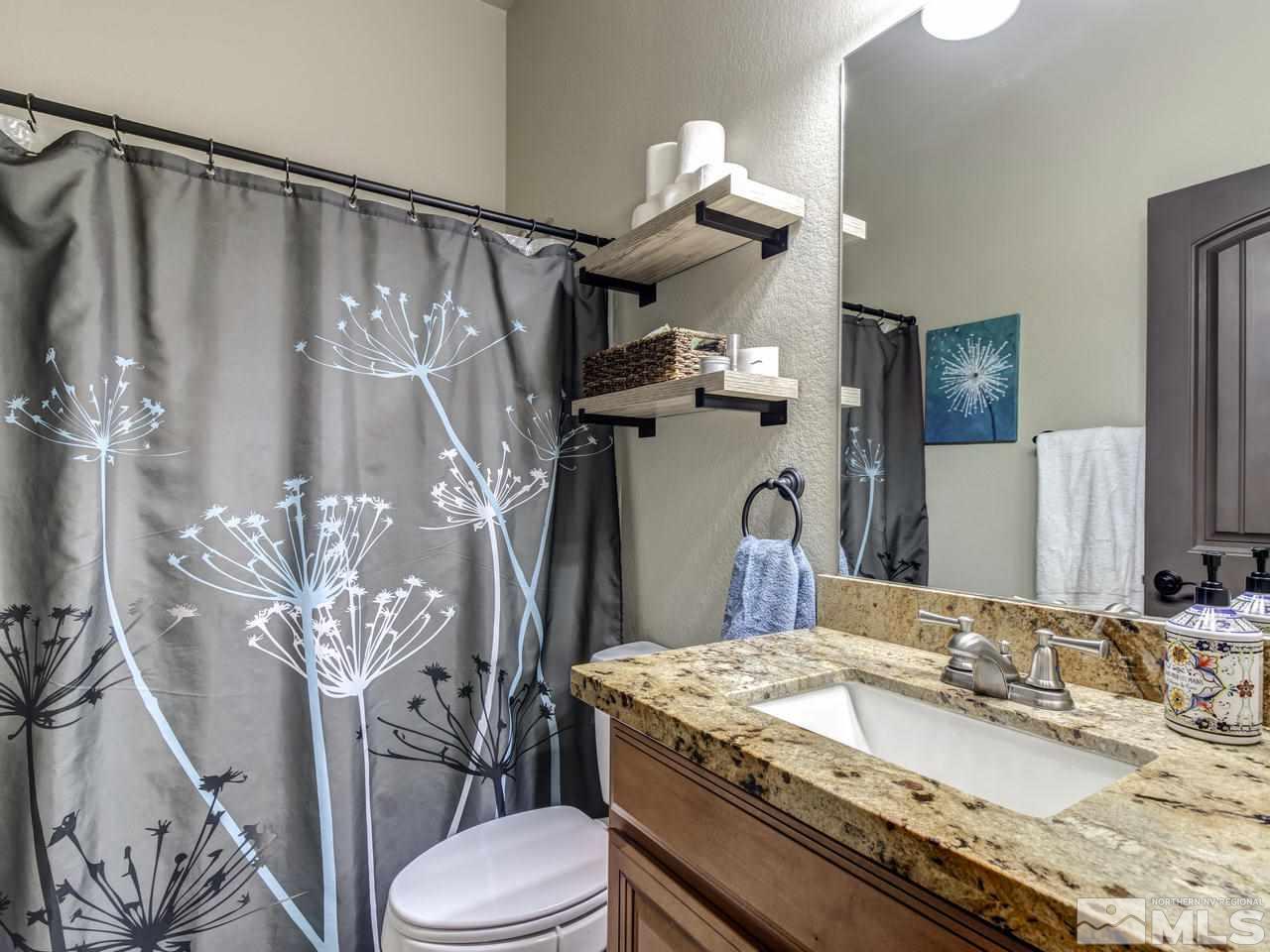 505 Split Rail Court Sparks, NV 89441 - Photo 21 of 25 a bathroom with a granite countertop sink toilet and shower