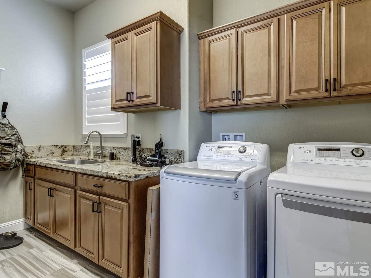 505 Split Rail Court Sparks, NV 89441 - Photo 22 of 25 a utility room with sink dryer and washer