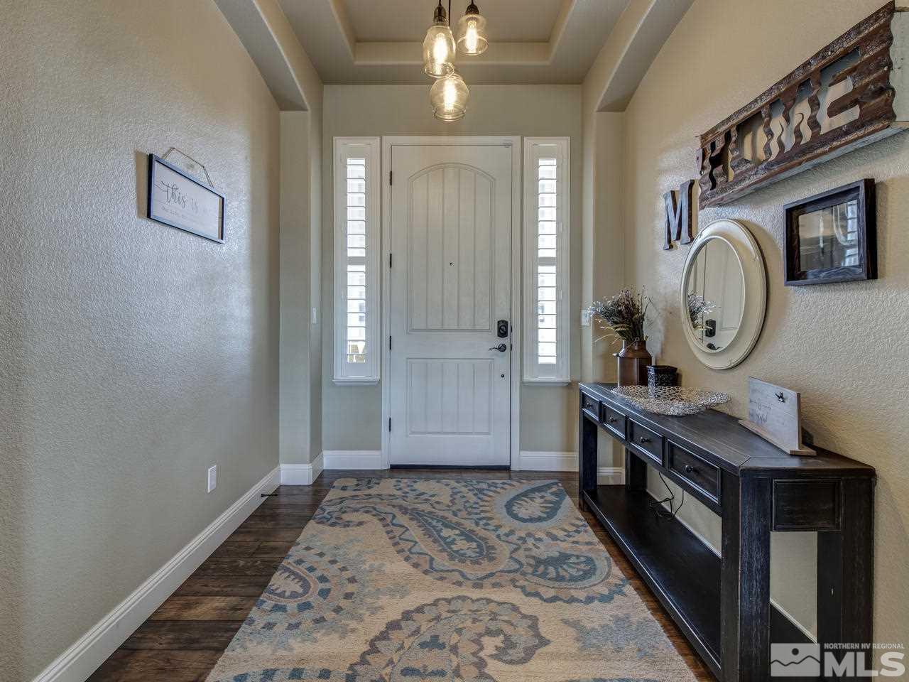 505 Split Rail Court Sparks, NV 89441 - Photo 3 of 25 a view of a hallway with entryway wooden floor and front door