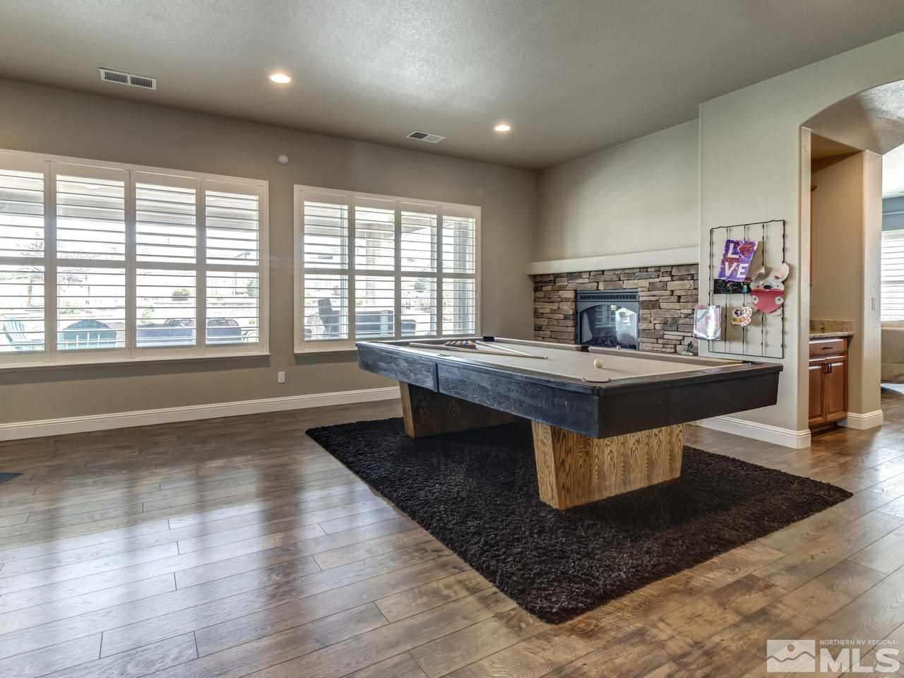 505 Split Rail Court Sparks, NV 89441 - Photo 4 of 25 a living room with fireplace furniture and a wooden floor