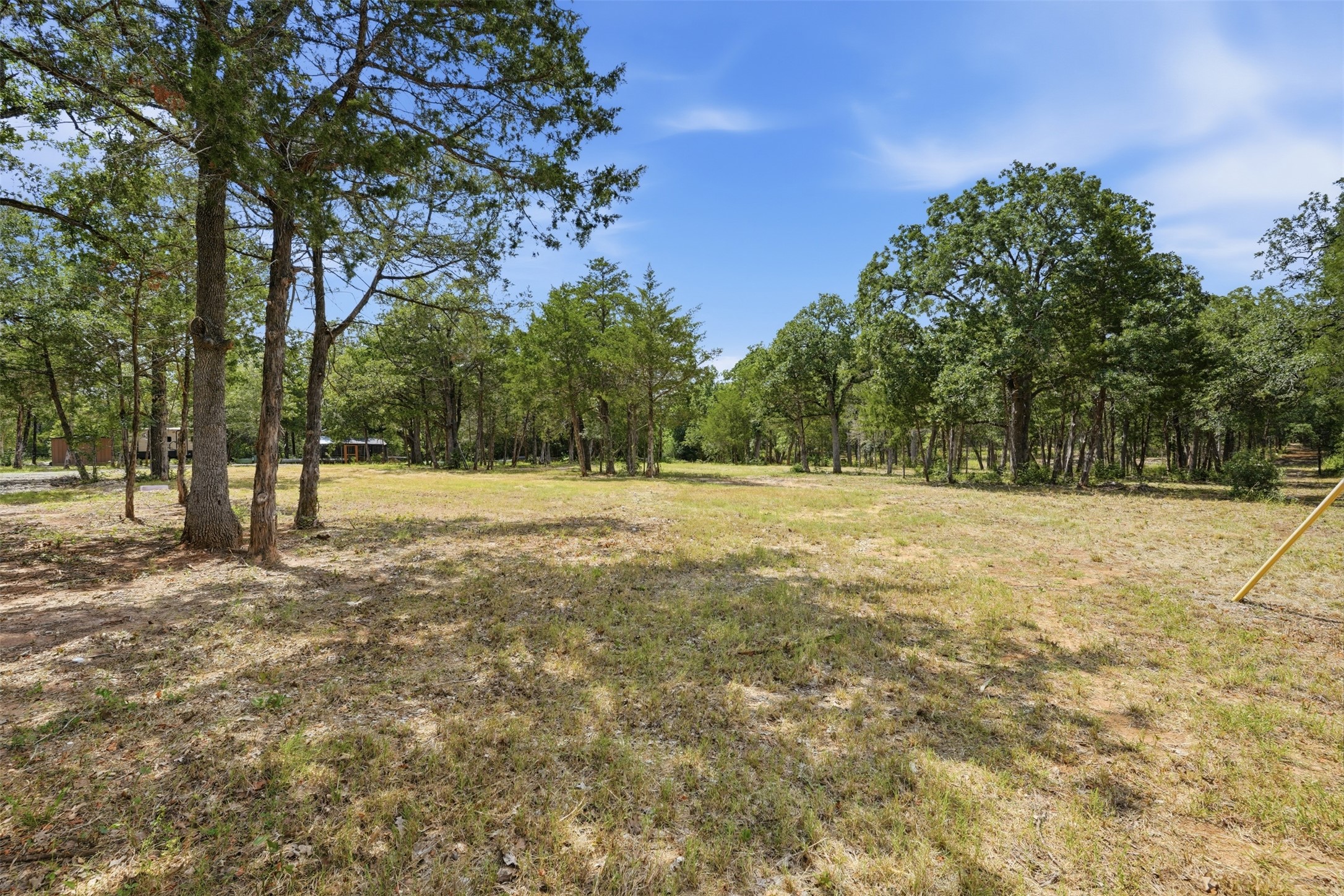 154 Antioch Road Smithville, TX 78957 - Photo 23 of 32 A spacious, naturally illuminated lot presents an exceptional building opportunity.