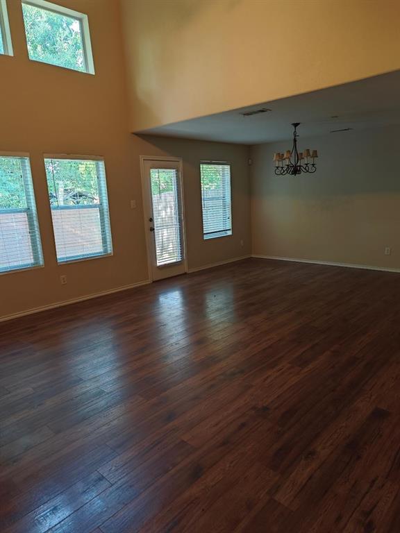 10059 Wake Bridge Drive Frisco, TX 75035 - Photo 4 of 10 an empty room with wooden floor and windows
