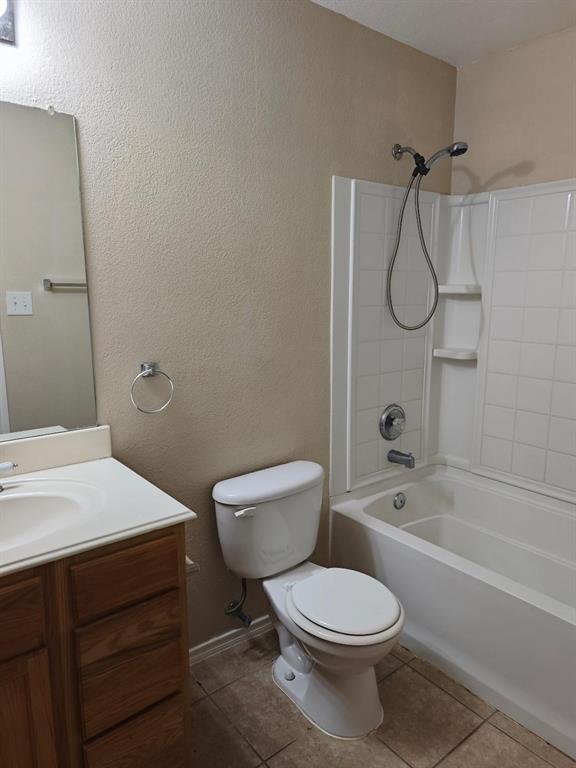 10059 Wake Bridge Drive Frisco, TX 75035 - Photo 7 of 10 a bathroom with a toilet sink vanity and shower
