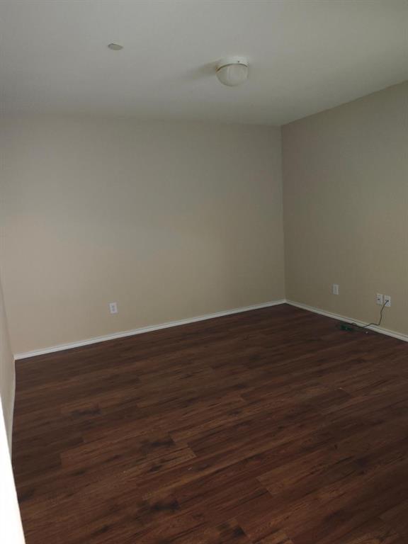 10059 Wake Bridge Drive Frisco, TX 75035 - Photo 9 of 10 a view of an empty room with wooden floor