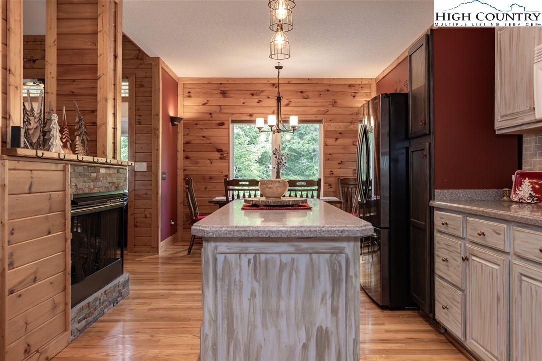 1328 Don Bare Road Jefferson, NC 28640 - Photo 21 of 49 a kitchen with stainless steel appliances granite countertop a stove a refrigerator and a stove