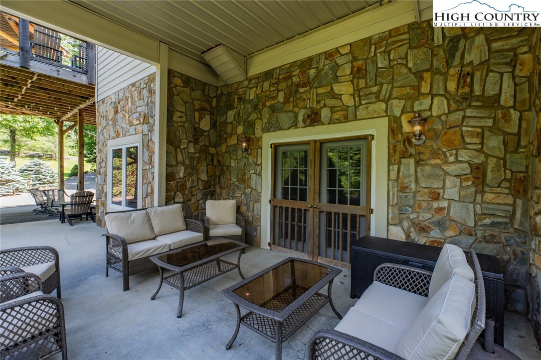 1328 Don Bare Road Jefferson, NC 28640 - Photo 42 of 49 a outdoor living space with furniture and a window