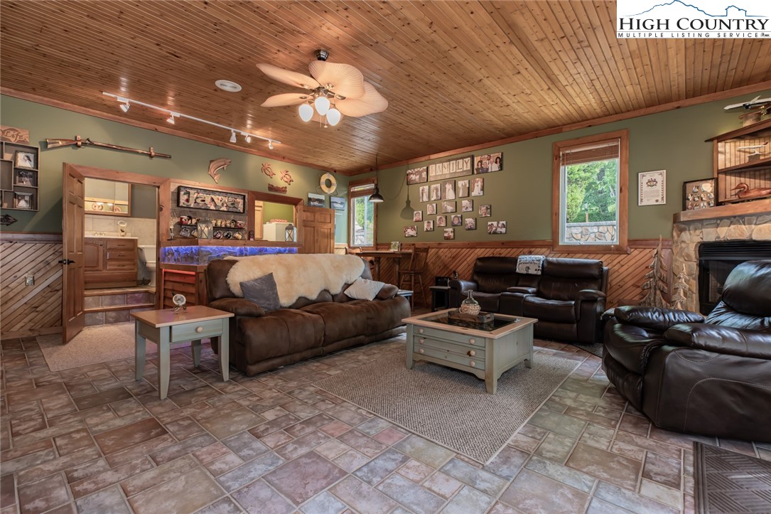 1328 Don Bare Road Jefferson, NC 28640 - Photo 8 of 49 a living room with furniture and a fireplace