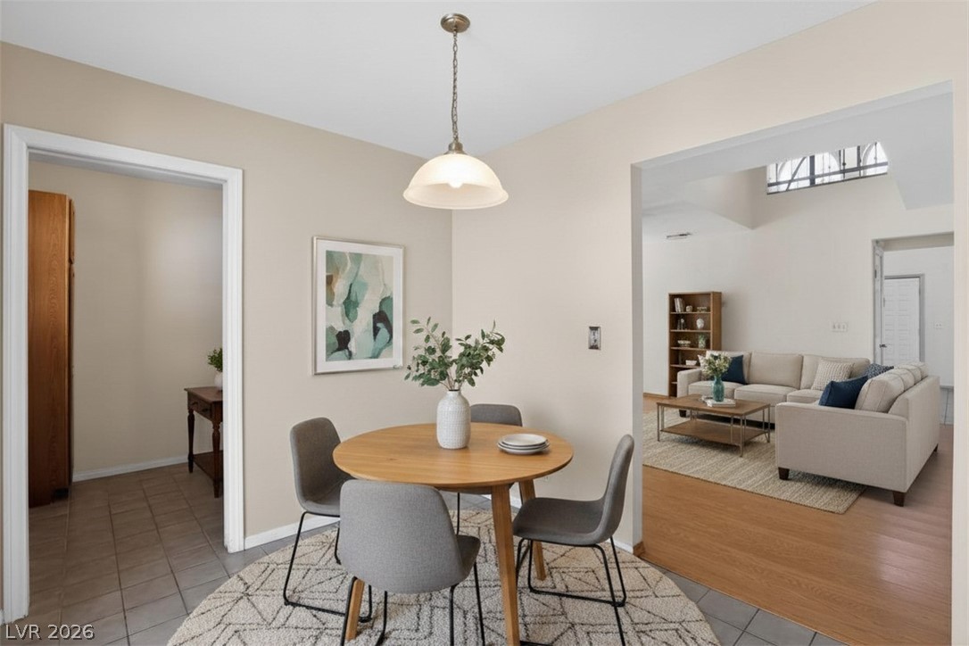 3698 Laughlin Boulevard Laughlin, NV 89029 - Photo 21 of 49 An inviting eat-in kitchen with pendant lighting flows seamlessly into a spacious living area.