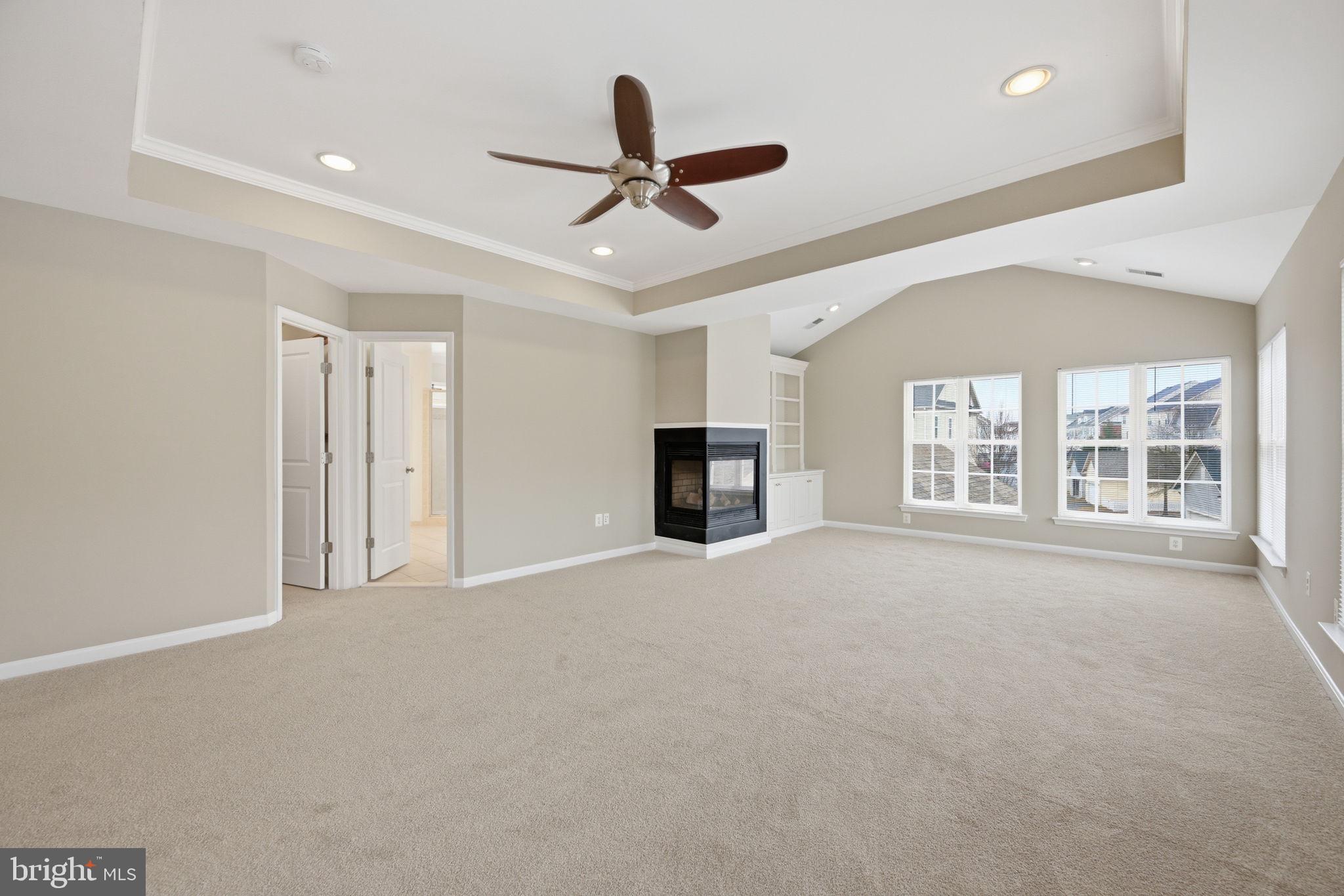 23710 Grapevine Ridge Terrace Clarksburg, MD 20871 - Photo 23 of 49 Primary Bed w/ two sided fireplace