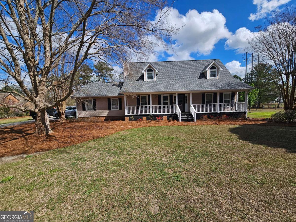 2001 Rutland Road, Unit 1 Tifton, GA 31793 - Photo 1 of 51 a front view of a building with street view and trees