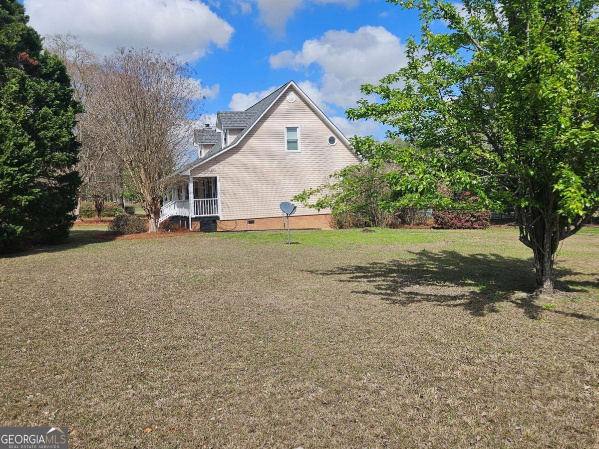 2001 Rutland Road, Unit 1 Tifton, GA 31793 - Photo 11 of 51 a view of a house with a yard