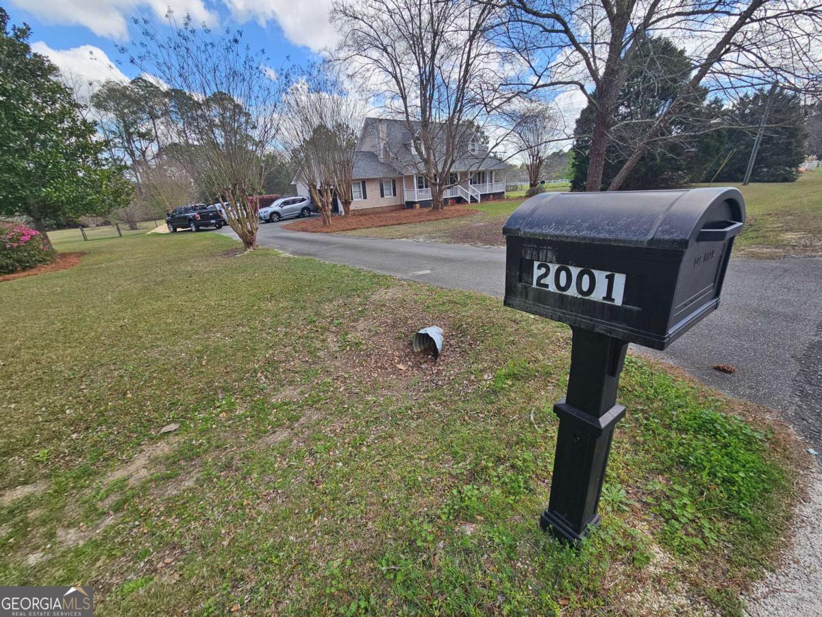 2001 Rutland Road, Unit 1 Tifton, GA 31793 - Photo 12 of 51 a street sign on the side of the road