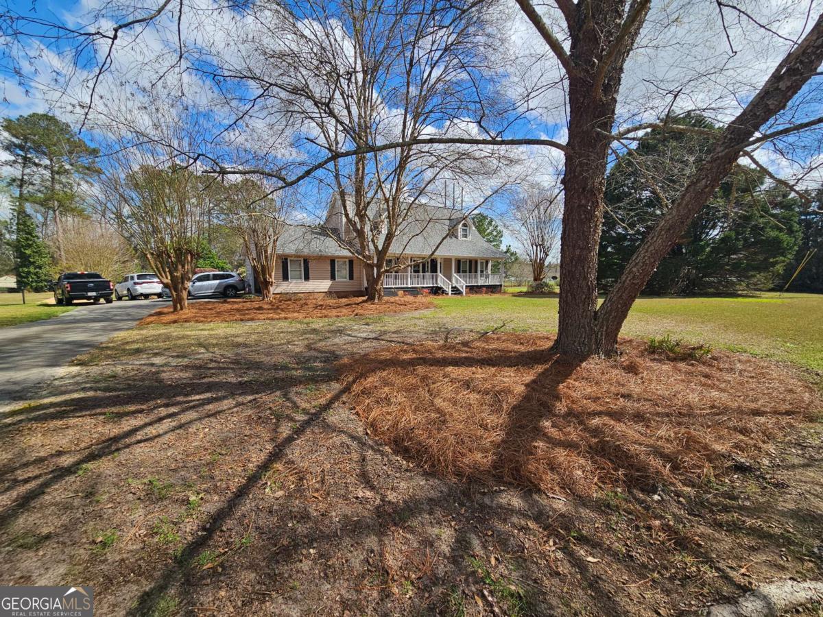 2001 Rutland Road, Unit 1 Tifton, GA 31793 - Photo 15 of 51 a view of a yard with a tree