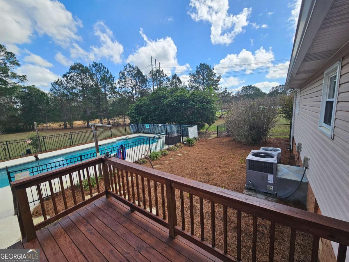2001 Rutland Road, Unit 1 Tifton, GA 31793 - Photo 23 of 51 a view of a balcony with wooden floor