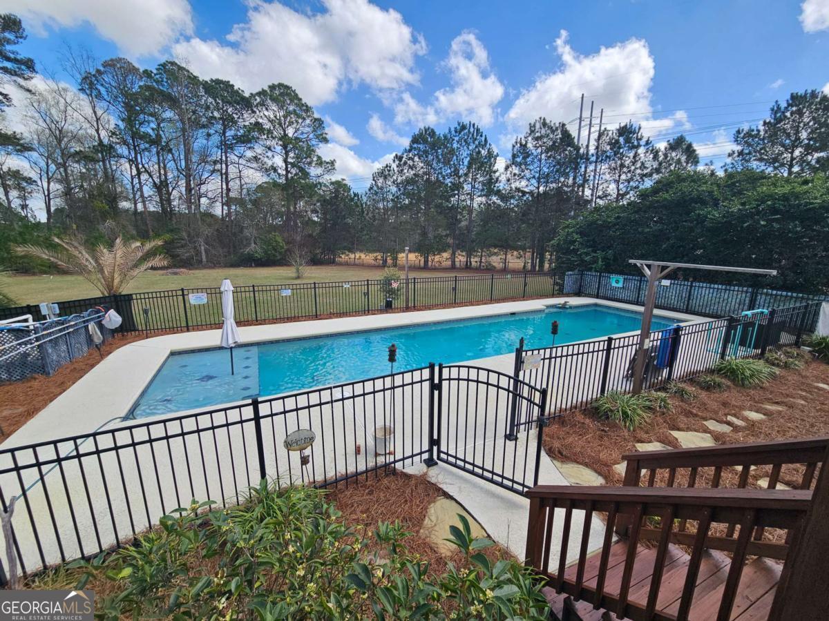 2001 Rutland Road, Unit 1 Tifton, GA 31793 - Photo 26 of 51 a view of a balcony with wooden floor