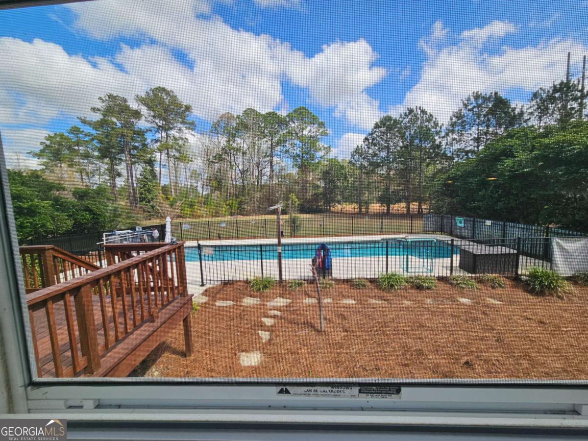 2001 Rutland Road, Unit 1 Tifton, GA 31793 - Photo 29 of 51 a view of a roof deck with wooden fence