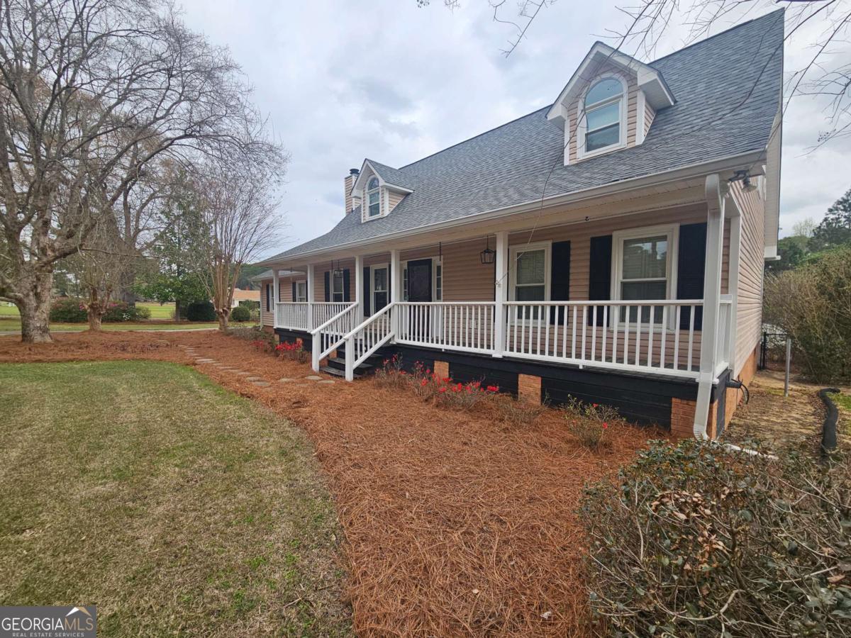 2001 Rutland Road, Unit 1 Tifton, GA 31793 - Photo 3 of 51 a front view of a house with a yard
