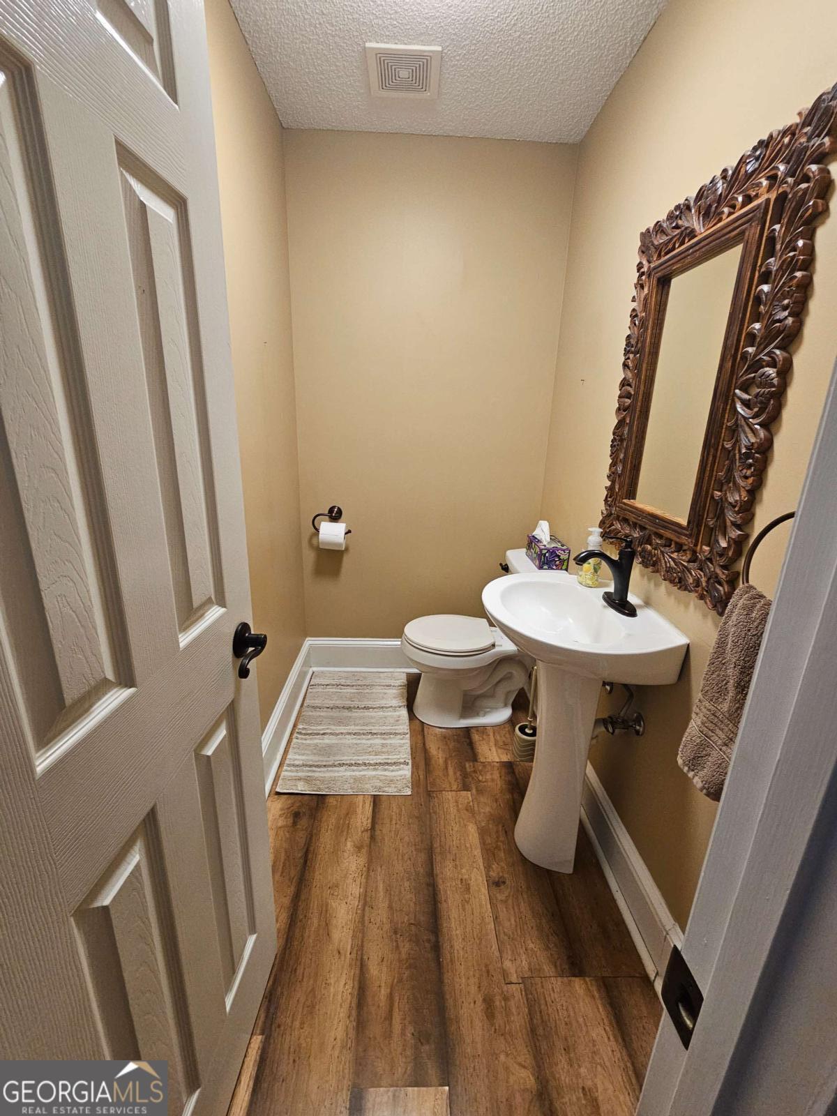 2001 Rutland Road, Unit 1 Tifton, GA 31793 - Photo 37 of 51 a bathroom with a sink and a mirror