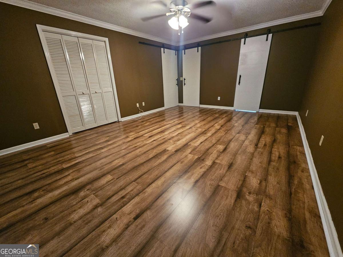 2001 Rutland Road, Unit 1 Tifton, GA 31793 - Photo 46 of 51 a view of a room with wooden floor