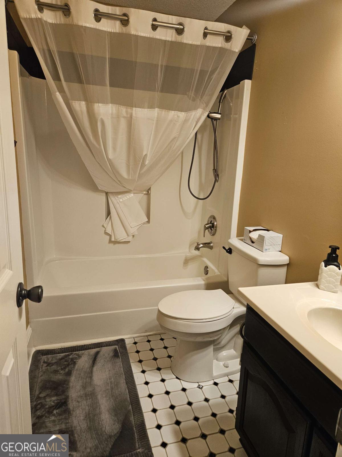 2001 Rutland Road, Unit 1 Tifton, GA 31793 - Photo 50 of 51 a bathroom with a sink and a mirror