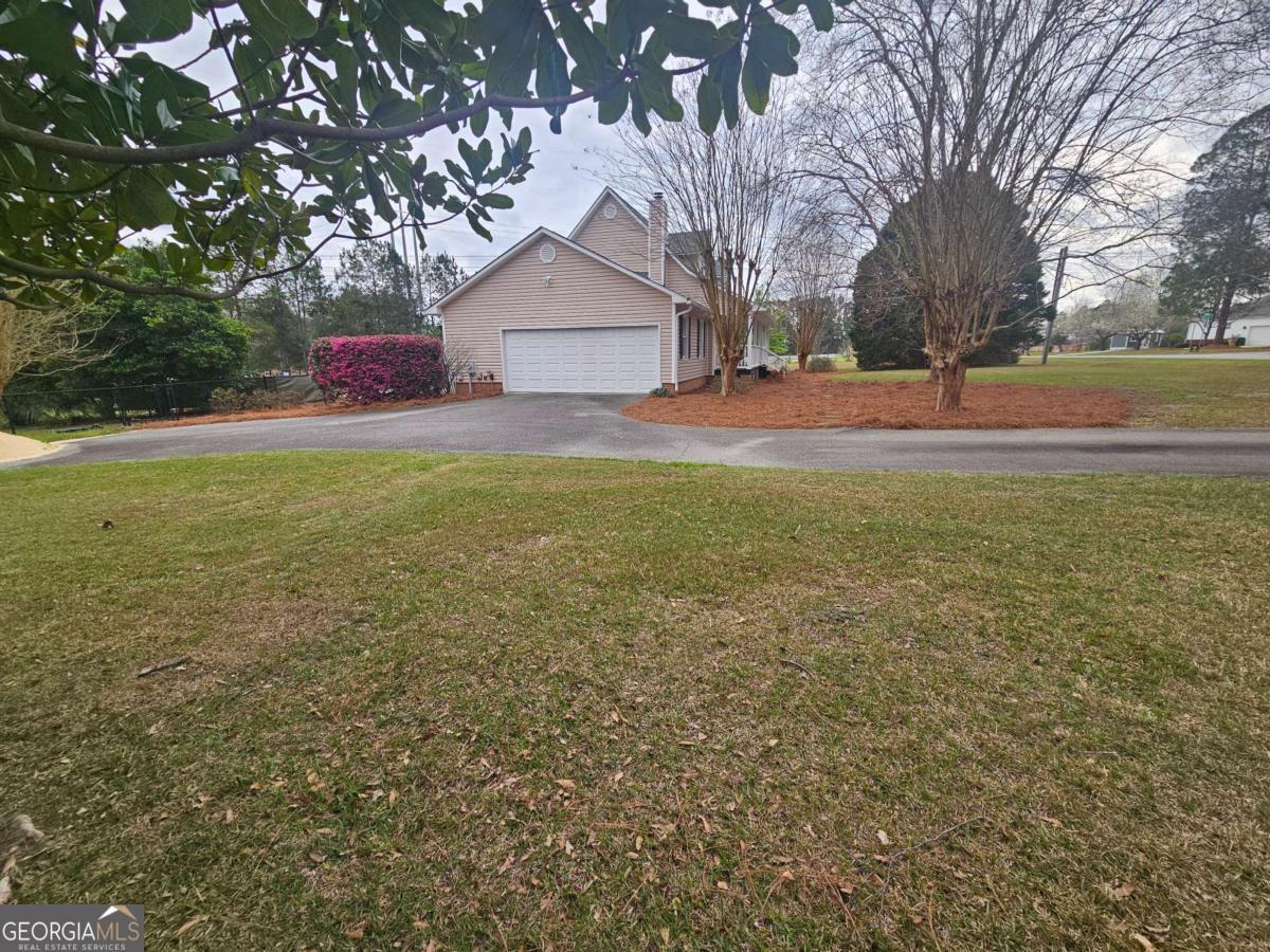 2001 Rutland Road, Unit 1 Tifton, GA 31793 - Photo 6 of 51 a front view of house with yard and trees