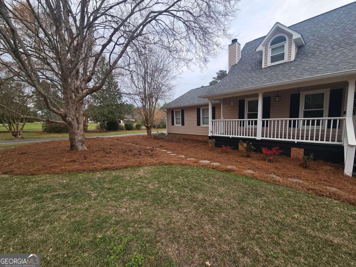 2001 Rutland Road, Unit 1 Tifton, GA 31793 - Photo 9 of 51 a front view of a house with a yard