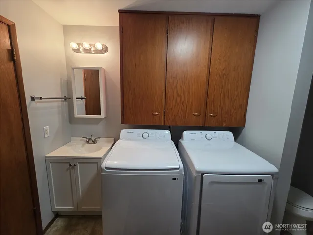 a utility room with dryer and washer