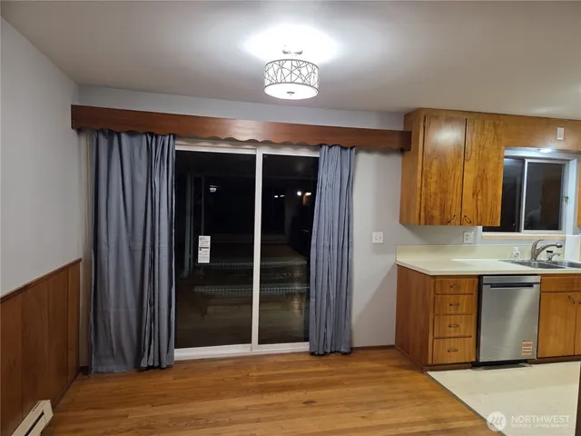 a view of a bathroom with a sink and a mirror