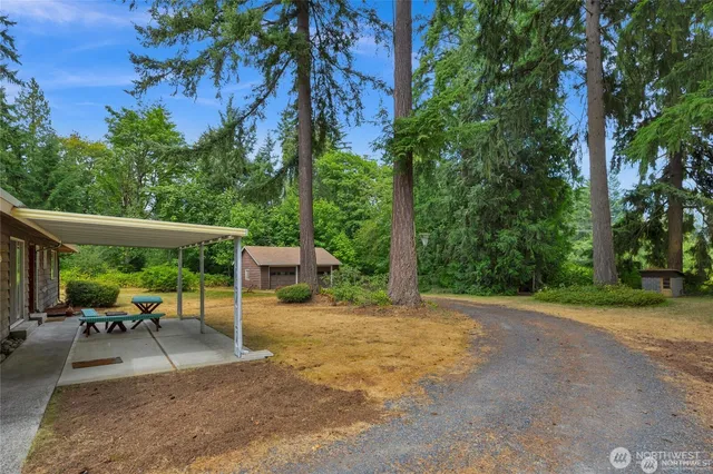 a view of a patio with a table chairs and a patio