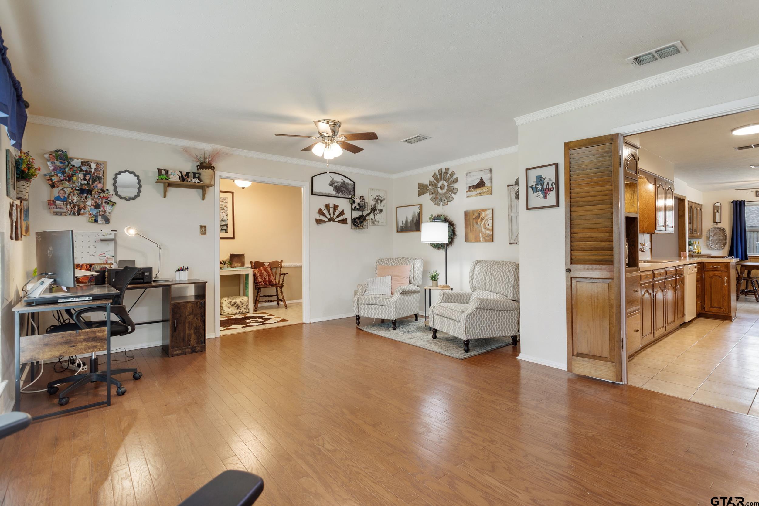 516 Ruthlynn Drive Longview, TX 75605 - Photo 16 of 34 a view of a livingroom with wooden floor and a couch