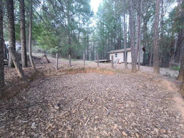 a backyard of a house with lots of green space