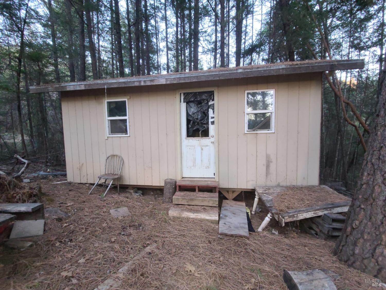 80250 Mina Road Covelo, CA 95428 - Photo 5 of 19 a view of a small house with a yard