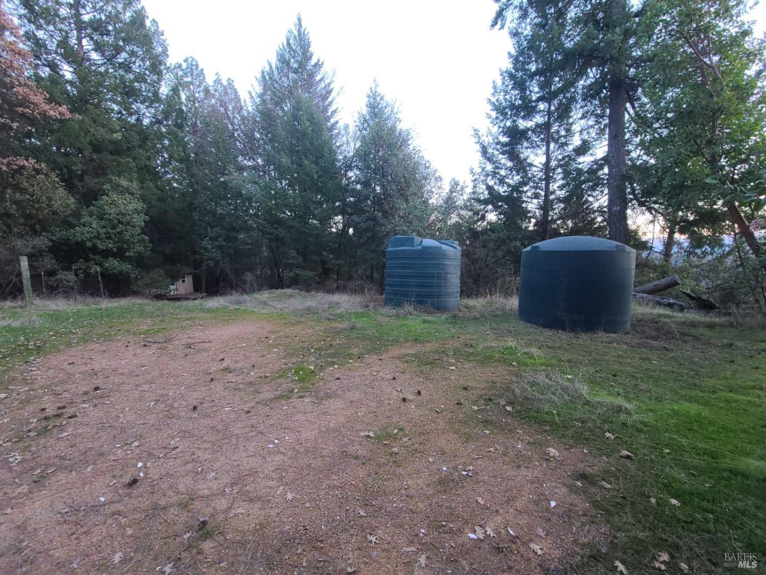 80250 Mina Road Covelo, CA 95428 - Photo 7 of 19 a view of a backyard with trees