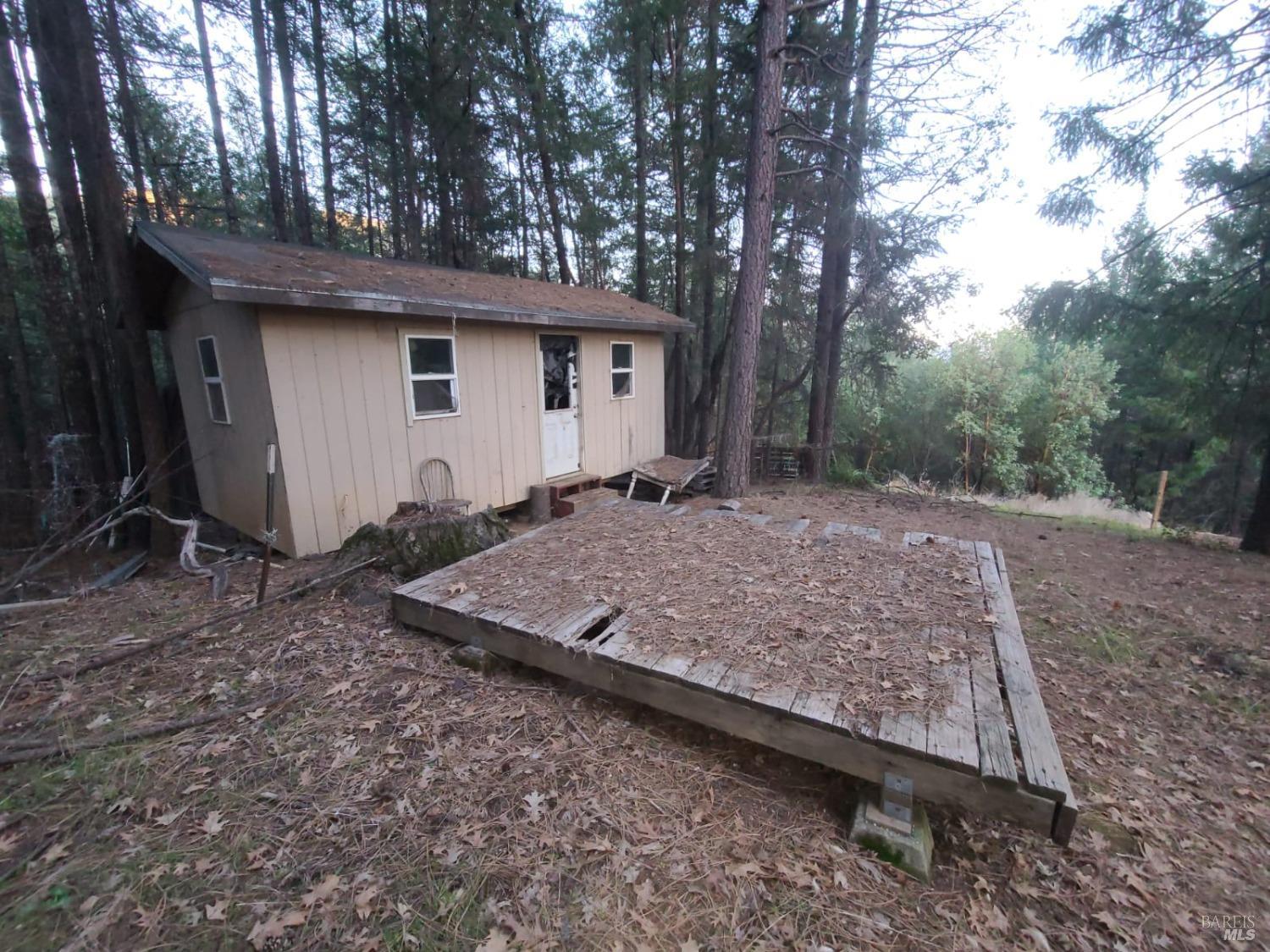 80250 Mina Road Covelo, CA 95428 - Photo 9 of 19 a view of a house with a yard and large tree