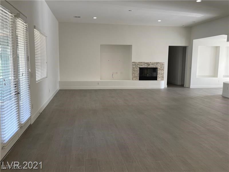6632 Rashelda Court Las Vegas, NV 89130 - Photo 11 of 27 Great room with Brazilian wood look porcelain plank flooring