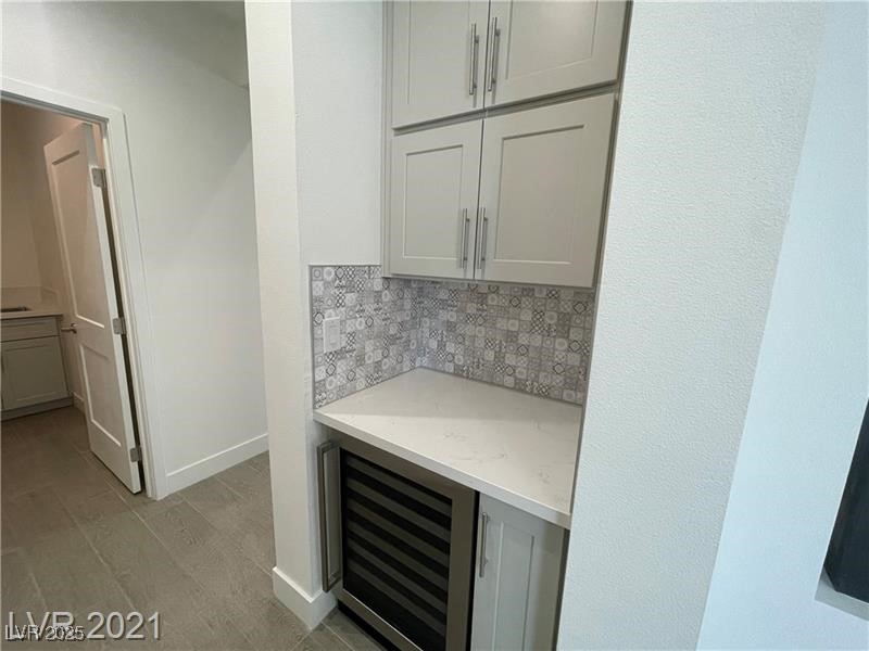 6632 Rashelda Court Las Vegas, NV 89130 - Photo 14 of 27 Beverage, coffee bar with refrigerator & cabinets