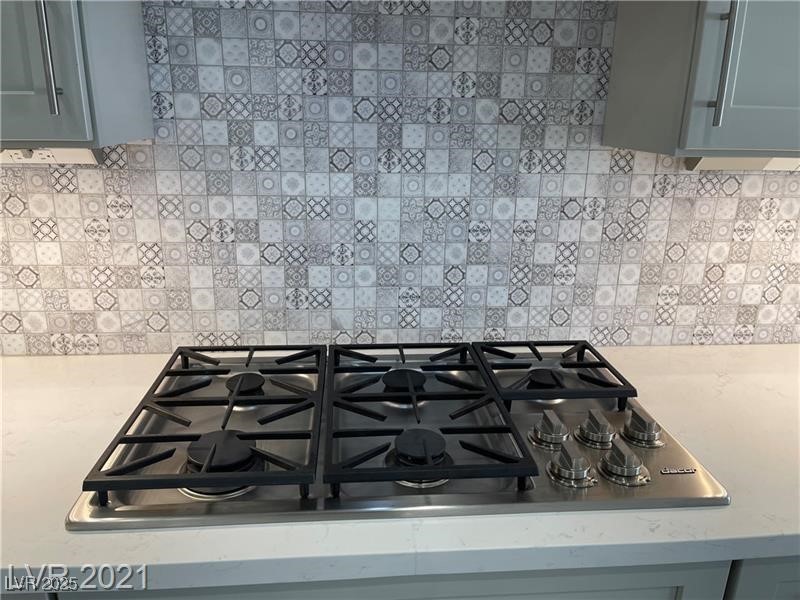 6632 Rashelda Court Las Vegas, NV 89130 - Photo 10 of 27 Stainless 5 burner cooktop and custom backsplash